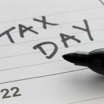 Tax Day written in black marker on a calendar